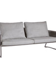 A grey Sifas Basket outdoor sofa with waterproof properties, set against a white background.