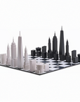 A black and white Skyline Chess Acrylic New York Folding Board with London buildings featuring skyscraper architecture.