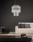 A modern living room with black furniture and a Masiero Vegas Chandelier.