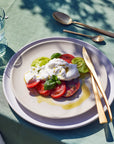Cutipol Duna Cutlery set in lifestyle setting along with ceramic crockery in outdoor setting