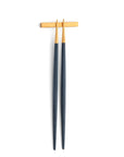 Cutipol Goa blue matt gold finish, black resin handles, and minimalist design for a luxurious dining experience - on a white background chopsticks with pillow