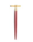 Cutipol Goa red matt gold finish, black resin handles, and minimalist design for a luxurious dining experience - on a white background chopsticks with rest