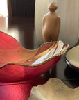 Gardeco Mapa Carmin 30 bowl styled with other glass objects and Visitor from Gardeco on a wooden dining table