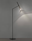 Baffo Collection by Italamp with conical design, titanium finish glass, and matching metal accents, showcasing Italian craftsmanship and elegance. A Baffo pedestal floor lamp in black and titanium finish on a grey background and wooden flooring