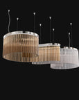 A close view with teak and clear glass in spiral shape. Discover the Carmen collection by Italamp – Italian Murano glass lighting in clear, smoke, and teak finishes. Elegant designs for luxurious interiors.