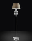 Chanel Collection chandelier by Italamp with carved crystal, chrome-finished metal, and dove fabric diffusers, showcasing Italian luxury and timeless design. A Chanel floor lamp with taupe finish fabric diffuser on a black background