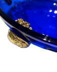 A stunning Mario Cioni Purpose Blue Gold Walnut Crystal Bowl with deep blue crystal, gold walnut accents, and intricate engraved leaf patterns, handcrafted in Italy.