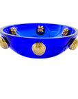 A stunning Mario Cioni Purpose Blue Gold Walnut Crystal Bowl with deep blue crystal, gold walnut accents, and intricate engraved leaf patterns, handcrafted in Italy. A closeup view