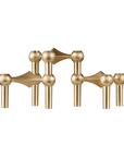 A set of modern candle stand brass fixtures with spherical and geometric decorative elements, shown against a plain white background.