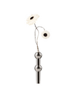 A decorative wall-mounted floral fixture with two white daisy-like flowers on thin dark stems, attached to a polished silver metal vertical bar with two rounded silver nodes, shown against a plain white background.