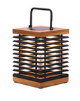 Decorative solar lantern with wooden top and black metal frame on a white background
