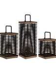 Three wooden solar lanterns with black metal frames on a white background