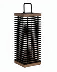 Tall black metal and wooden solar lantern on a white background