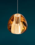 Terzani Mizu Pendant Light Spacio India in cognac finish on a blue background
