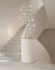 Terzani Mizu Pendant Italian crystal light installation in a stairwell. Available at Spacio retail stores in Mumbai & Kolkata.
