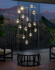 Terzani Mizu Pendant Italian crystal light installation in a luxury indoor setting with picturesque view of mountains. Available at Spacio retail stores in Mumbai & Kolkata.