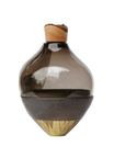 Decorative sculptural vase with a wooden top and base on a white background from Utopia & Utility, available at Spacio retail stores in Mumbai & Kolkata.