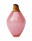 Pink vase with a wooden top on a white background
