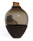 Vase with two-tone design made of wood, glass & ceramic on a white background from Utopia & Utility, available at Spacio retail stores in Mumbai & Kolkata.