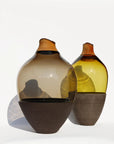 Two glass vases with gradient colors on a white background