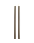 Two slim matte sandstone LED slim taper candles with lit flame tips, standing upright against a plain white background.
