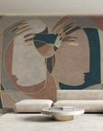 A Spanish artist's living room with a large abstract painting on the wall, showcasing mesmerizing Affreschi Inner Line Collection wallpaper designs that evoke a strong human connection.
