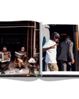 Assouline New York Chic coffee table book displaying photos of Men reading newspaper & a Rapper on white back ground available at Spacio India for luxury home decor accessories collection of Travel Coffee Table Books.