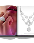 Assouline Boghossian: Expertise Craftsmanship Innovation coffee table book displaying photo of Boghossian Necklace & Ring on hand on white background at Spacio India for luxury home decor collection of Jewellery Coffee Table Books.