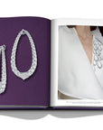 Assouline Boghossian: Expertise Craftsmanship Innovation coffee table book displaying photo of Boghossian Merveilles Halo 18k White Gold Diamond Extra Large Earrings & it wored on white dress as fashion on white background at Spacio India for luxury home decor collection of Jewellery Coffee Table Books.