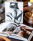 Assouline Buccellati: A Century of Timeless Beauty coffee table book on a royal coffee table with other accessories at Spacio India for luxury home decor collection of Jewellery Coffee Table Books.