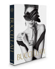 Side look of Assouline Buccellati: A Century of Timeless Beauty coffee table book on a white background at Spacio India for luxury home decor collection of Jewellery Coffee Table Books.