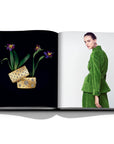 Assouline Buccellati: A Century of Timeless Beauty coffee table book displaying diamond bangles & Model wearing earings on a white background at Spacio India for luxury home decor collection of Jewellery Coffee Table Books.