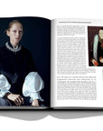 Assouline Buccellati: A Century of Timeless Beauty coffee table book displaying a lady dressed as Elizabeth I - Former Queen of England and Ireland wearing a diamond necklace on a white background at Spacio India for luxury home decor collection of Jewellery Coffee Table Books.