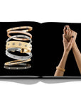 Assouline Buccellati: A Century of Timeless Beauty coffee table book displaying Gold & Silver Bracelets & a lady wering bracelet on a white background at Spacio India for luxury home decor collection of Jewellery Coffee Table Books.