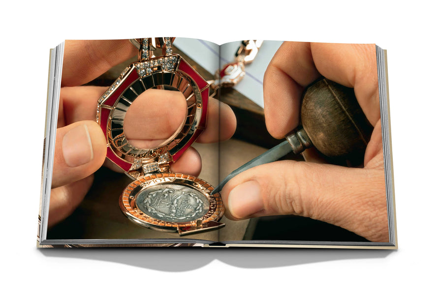 Assouline Bvlgari: Beyond Time coffee table book displaying The new Bulgari Monete High Jewellery Pendant Secret Watch features an ancient silver Greek coin on white back ground at Spacio India for luxury home decor collection of Jewellery Coffee Table Books.