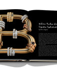 Assouline Bvlgari: Beyond Time coffee table book displaying Serpenti Bvlgari Jewelry Collection in a form of B Letter on white back ground at Spacio India for luxury home decor collection of Jewellery Coffee Table Books.