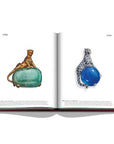 Assouline Cartier: The Impossible Collection coffee table book displaying Cartier 'Panthere' sapphire and diamond brooch & a brooch featuring a yellow gold panther perched on a 116-carat cabochon-cut emerald on white back ground available at Spacio India for luxury home decor collection of Ultimate & Jewellery Coffee Table Books.