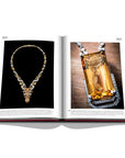 Assouline Cartier: The Impossible Collection coffee table book displaying Panther intaglio necklace, circa 2021 & The Pixelage Necklace on white back ground available at Spacio India for luxury home decor collection of Ultimate & Jewellery Coffee Table Books.