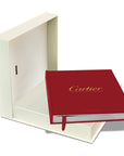 Assouline Cartier: The Impossible Collection coffee table book with its opened cover on white back ground available at Spacio India for luxury home decor collection of Ultimate & Jewellery Coffee Table Books.