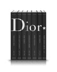 Assouline Dior by John Galliano coffee table book sets from different fashion designers on a white back ground available at Spacio India for luxury home decor collection of Fashion Coffee Table Books.