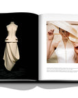 Assouline Dior by John Galliano coffee table book displaying photo of Model Karen Elson waeing the Cunard Line ensemble in July, 1998 on a white back ground available at Spacio India for luxury home decor collection of Fashion Coffee Table Books.