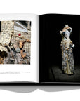 Assouline Dior by John Galliano coffee table book displaying photo of bustier in beige and ecru linen and a pajama-skirt in plaid wool and silk tulle on a white back ground available at Spacio India for luxury home decor collection of Fashion Coffee Table Books.