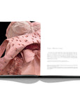 Assouline Dior by Marc Bohan coffee table book displaying photo of light pink gown's detailed work on a white back ground available at Spacio India for luxury home decor collection of Fashion Coffee Table Books.