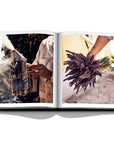 Assouline Louis Vuitton Manufactures coffee table book displaying photo of dry Lavendor flowers & steel smoker on white background at Spacio India for luxury home decor collection of Fashion Coffee Table Books.