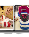 Assouline Louis Vuitton Manufactures coffee table book displaying photo of Louis Vuitton Shoes on white background at Spacio India for luxury home decor collection of Fashion Coffee Table Books.