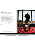 Assouline Louis Vuitton: Virgil Abloh Classic Cartoon Cover coffee table book displaying photo of Virgil Abloh Back facing - photo by Assouline on a white back ground available at Spacio India for luxury home decor accessories collection of Fashion Coffee Table Books.