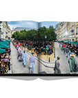 Assouline Louis Vuitton: Virgil Abloh Classic Cartoon Cover coffee table book displaying photo of Louis Vuitton’s menswear spring/summer 2020 fashion show on a white back ground available at Spacio India for luxury home decor accessories collection of Fashion Coffee Table Books.