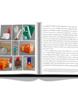 Assouline Louis Vuitton: Virgil Abloh Classic Cartoon Cover coffee table book displaying photos of Louis Vuitton Accessories with information on a white back ground available at Spacio India for luxury home decor accessories collection of Fashion Coffee Table Books.