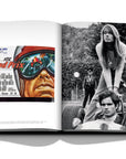 Assouline Formula 1: The Impossible Collection coffee table book displaying photos of Françoise Hardy, French singer-songwriter with Antonio Sabàto Sr. Italian film actor & Grand Prix Poster on a white back ground available at Spacio India for luxury home decor collection of Ultimate & Sports Coffee Table Books.
