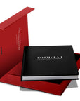 Opened cover of Assouline Formula 1: The Impossible Collection coffee table book on a white back ground available at Spacio India for luxury home decor collection of Ultimate & Sports Coffee Table Books.